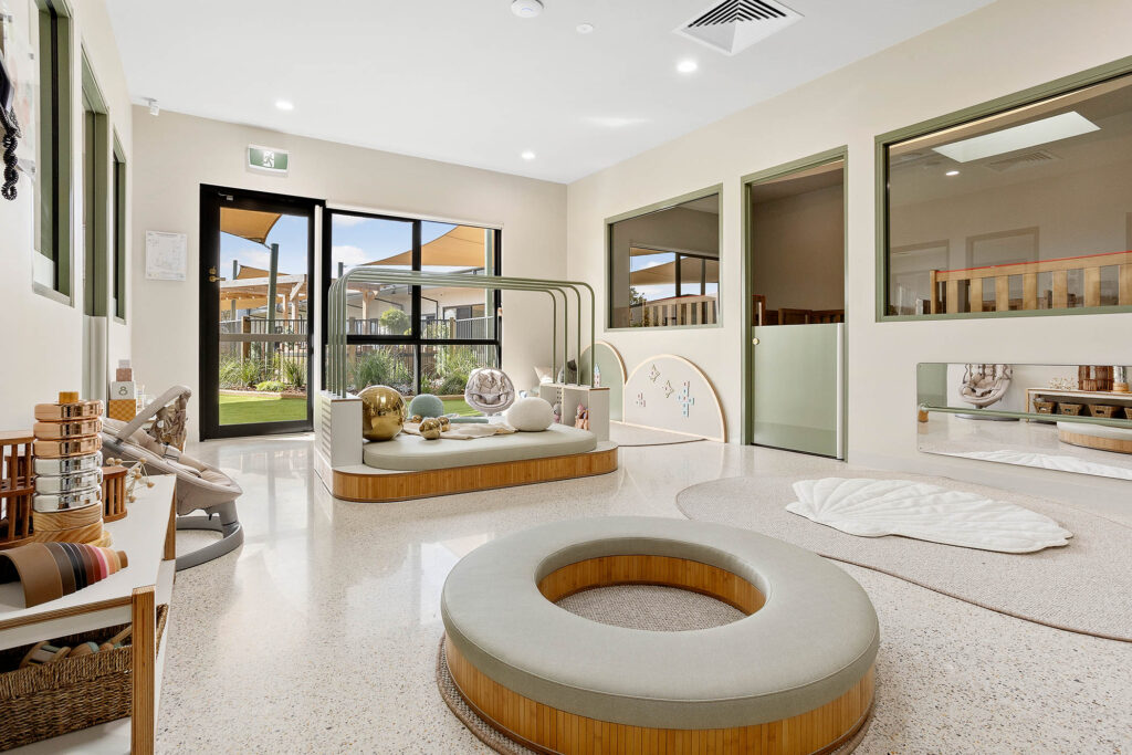 A elegant living room space with white sofa at Nido childcare centre