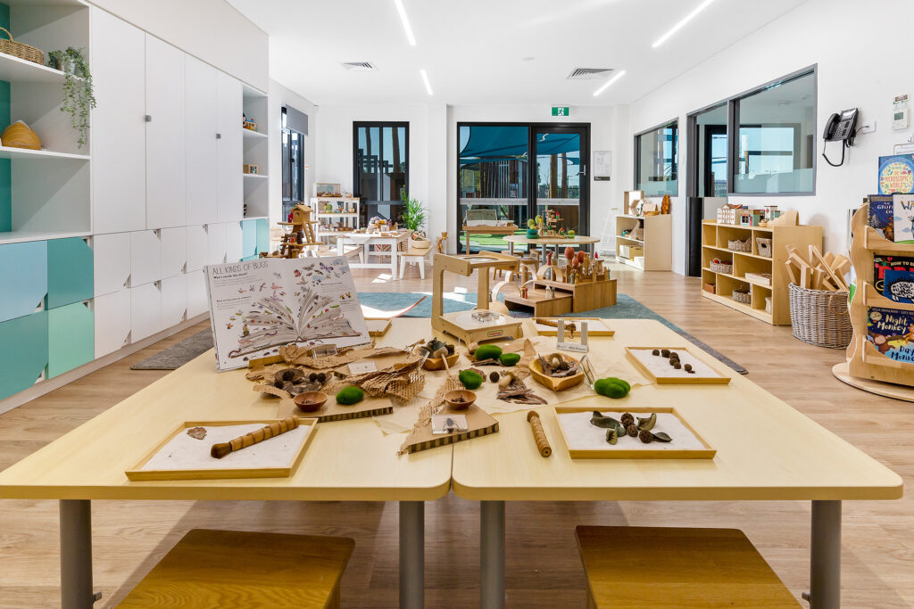 Nido Riverton Living room with Wooden tables, cupboards, basket and small wooden benches