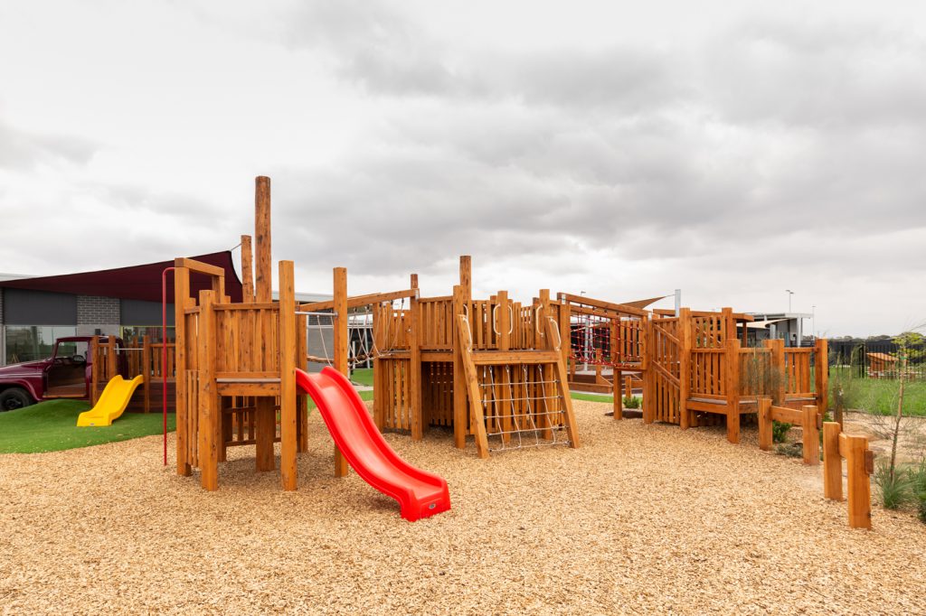 children outside playground image of nido child care centre in wyndham vale