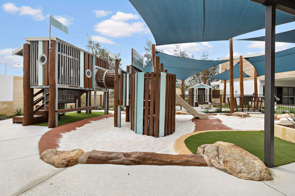Outdoor wooden playing structure at Nido Alkimos childcare centre