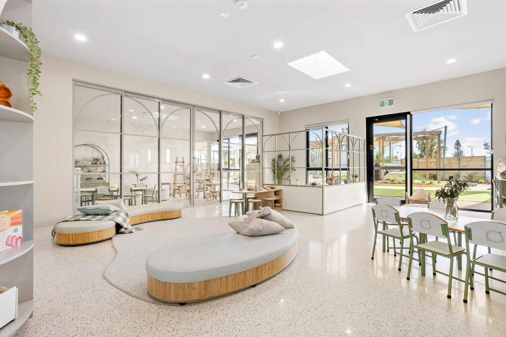 A Beautiful living room space with white sofa at Nido childcare centre