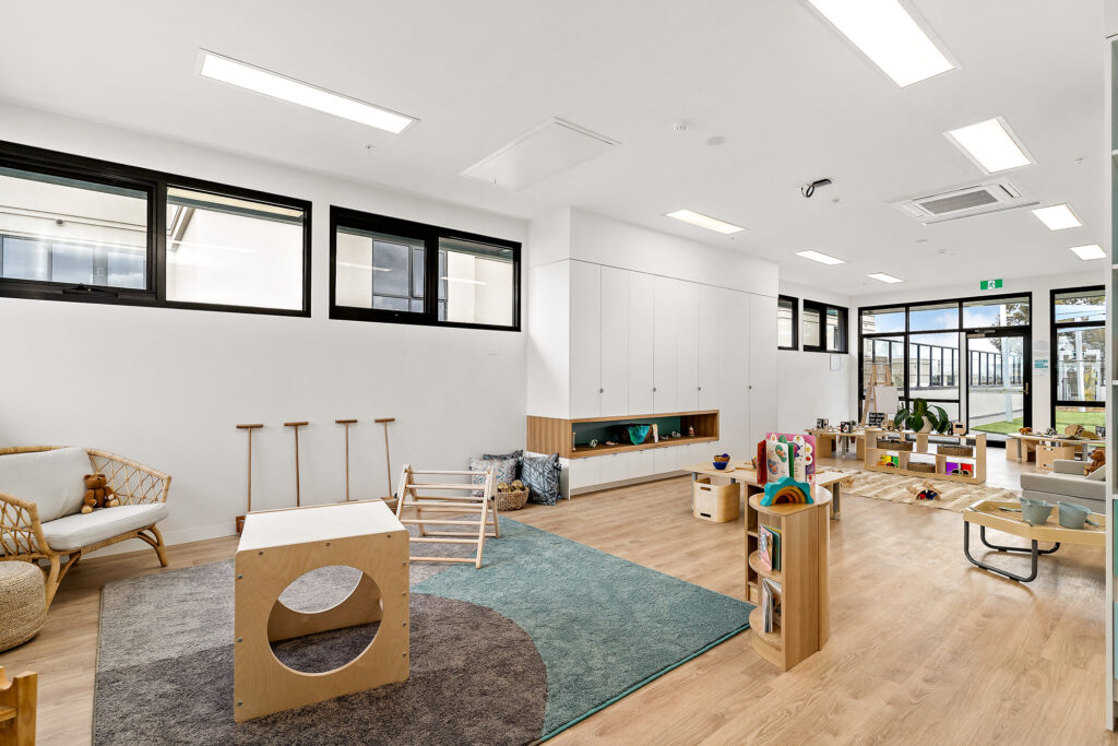 Nido Essendon Living room with wooden chair, rack, stand and sofa